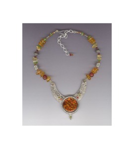SCHEDERAZADE NECKLACE Inspiration from the Arabian Nights, the pendant is fine silver designed and handmade by Sandy Mooney. The centerpiece is a fused glass piece also made by Sandy. The necklace includes amber, carnelian, peridot and quartz gemstones.